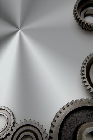 Metal gears on shiny steelの写真素材