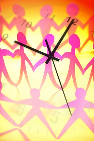 Team holding hands and clock