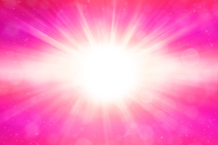Abstract pink blast of light backgroundの写真素材
