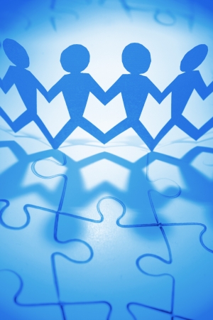 Group of people and jigsaw puzzle の写真素材