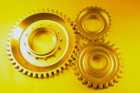 Three steel cog wheels together