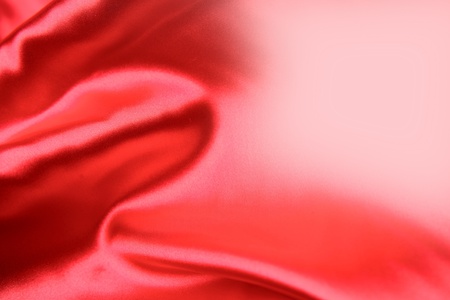 Closeup of folds in red silk fabric  の写真素材