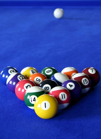 Pool balls on blue pool table