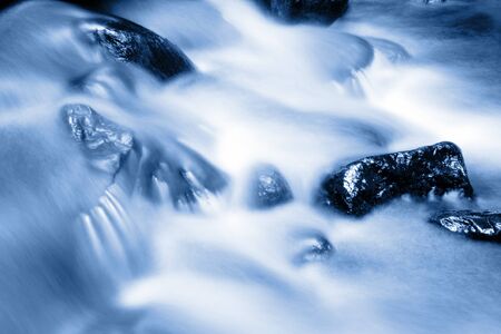 Stream and rocks. Blue tone