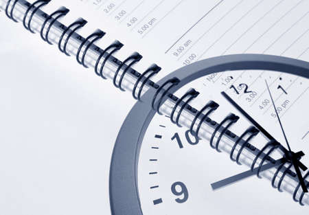 Clock face and diary pageの写真素材