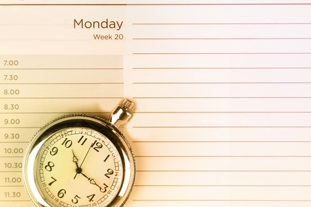 Pocket watch on diary pageの写真素材