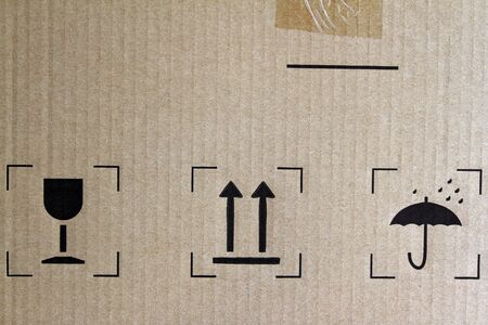 Glass, arrows and umbrella signs on cardboardの写真素材