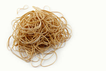 Pile of rubber bands on plain background