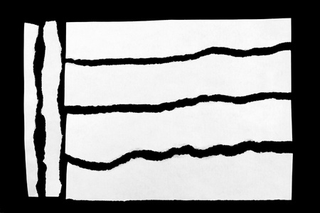 Torn pieces of paper on black background Torn pieces of paper on black background