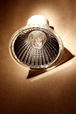 Halogen light bulb on brown backgroundの写真素材