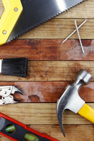 Assorted work tools on woodの写真素材