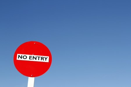 No entry sign against blue skyの写真素材
