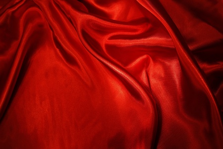 Closeup of rippled red silk fabricの写真素材