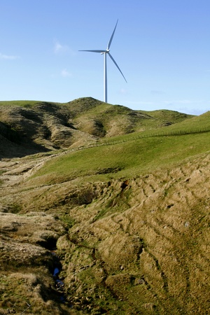 Giant wind turbine on hill 