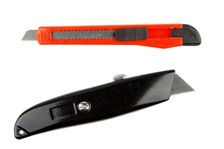 Two box cutter knives isolated over white