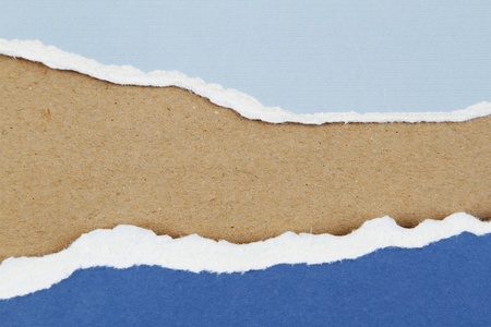 Hole ripped in paper on brown background  Copy spaceの写真素材