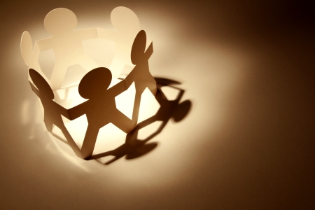 Paper chain people holding hands  Teamwork conceptの写真素材