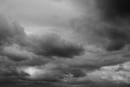 Dark ominous grey storm clouds. Dramatic sky. Dark ominous grey storm clouds. Dramatic sky.