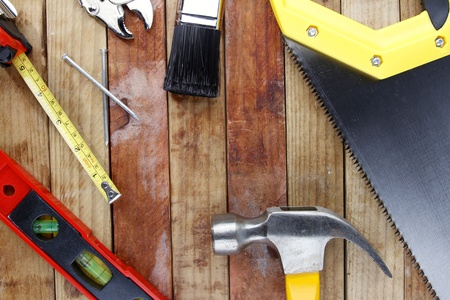 Assorted work tools on woodの写真素材