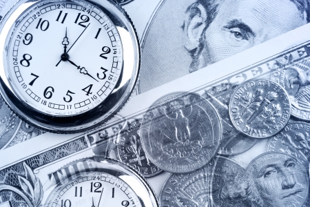 Clocks, coins and banknotes. Time is money concept