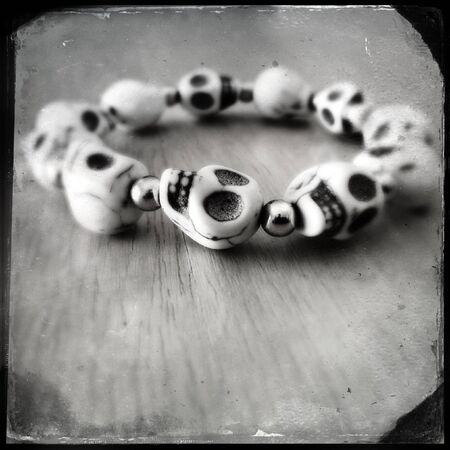 Closeup of spooky skulls braceletの写真素材
