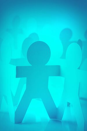 Paper doll people holding handsの写真素材