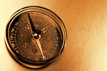 Single compass on brown backgroundの写真素材
