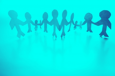 Paper doll people holding handsの写真素材