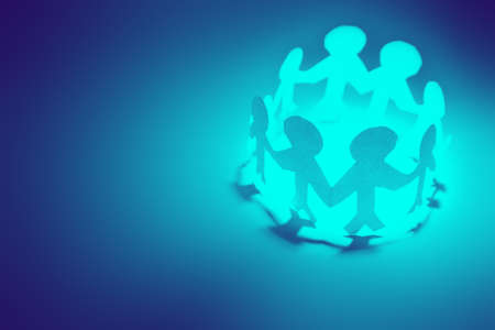 Paper doll people holding handsの写真素材