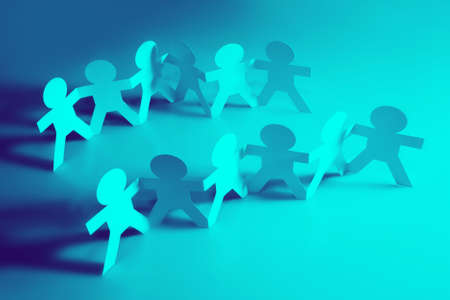 Paper doll people holding handsの写真素材