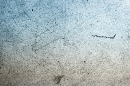 Closeup of blue and brown color textured concrete wall surfaceの写真素材