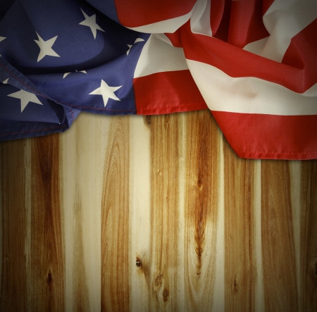 Closeup of American flag on wooden backgroundの写真素材