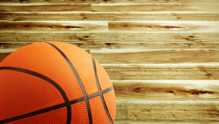 Closeup of a basketball and wooden floorの写真素材