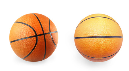 Two basketballs on plain background