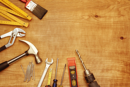 Assorted work tools on wood