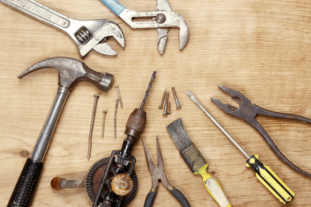Assorted old work tools on woodの写真素材
