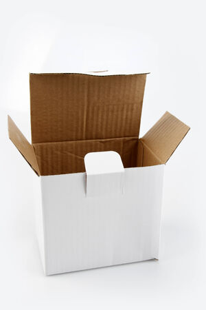 Open cardboard box on plain background