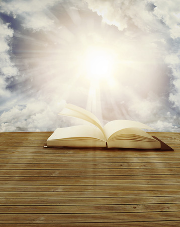 Open book in front of skyの写真素材