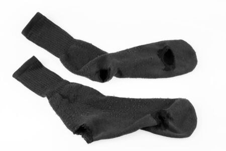 Pair of socks with holes in themの写真素材