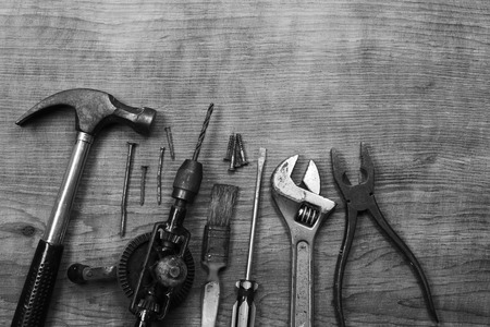 Assorted work tools on wood