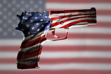 Handgun and American flag compositeの写真素材
