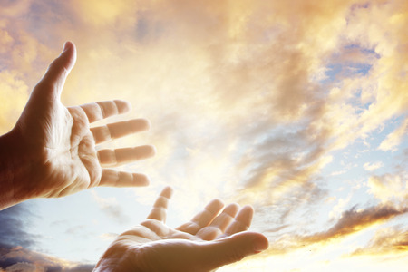 Hands reaching for the skyの写真素材