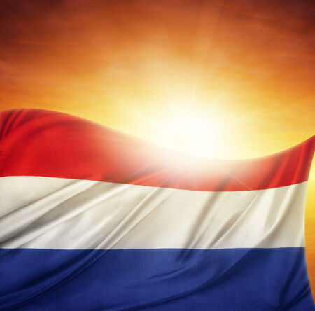 Netherlands flag in front of bright skyの写真素材