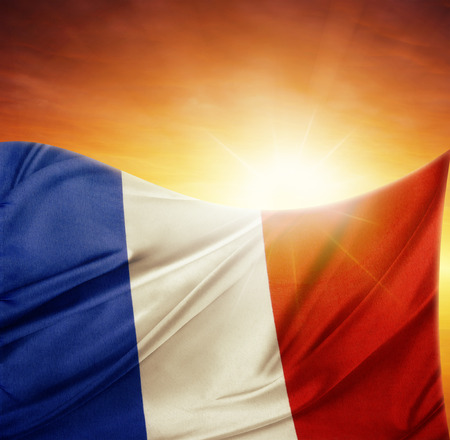 French flag in front of bright skyの写真素材