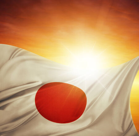 Japanese flag in front of bright skyの写真素材