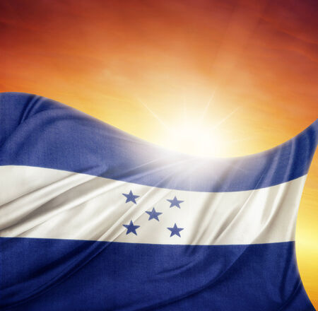Honduras flag in front of bright skyの写真素材
