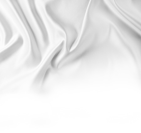 Closeup of rippled silk fabric on white backgroundの写真素材