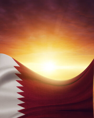 Qatar flag in front of bright skyの写真素材