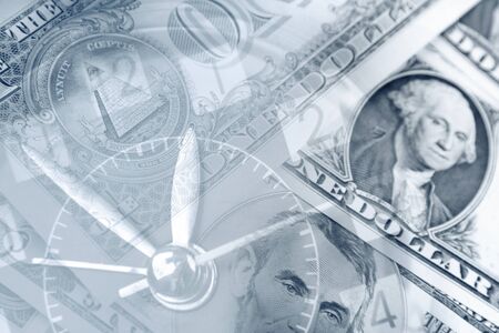 Clock face and American currencyの写真素材