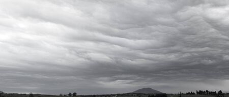 Dark ominous grey storm cloudsの写真素材